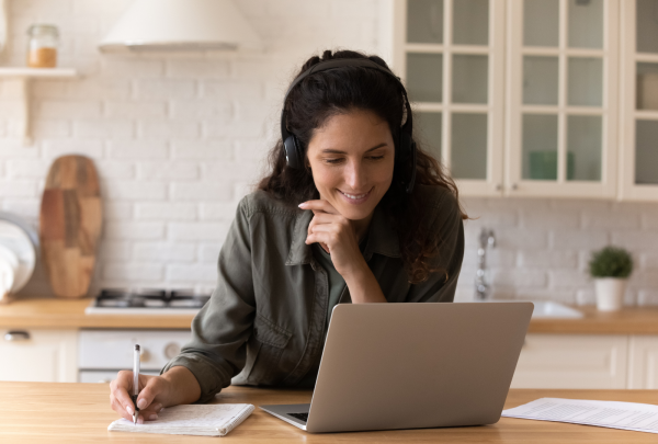 Women smiling at laptop
